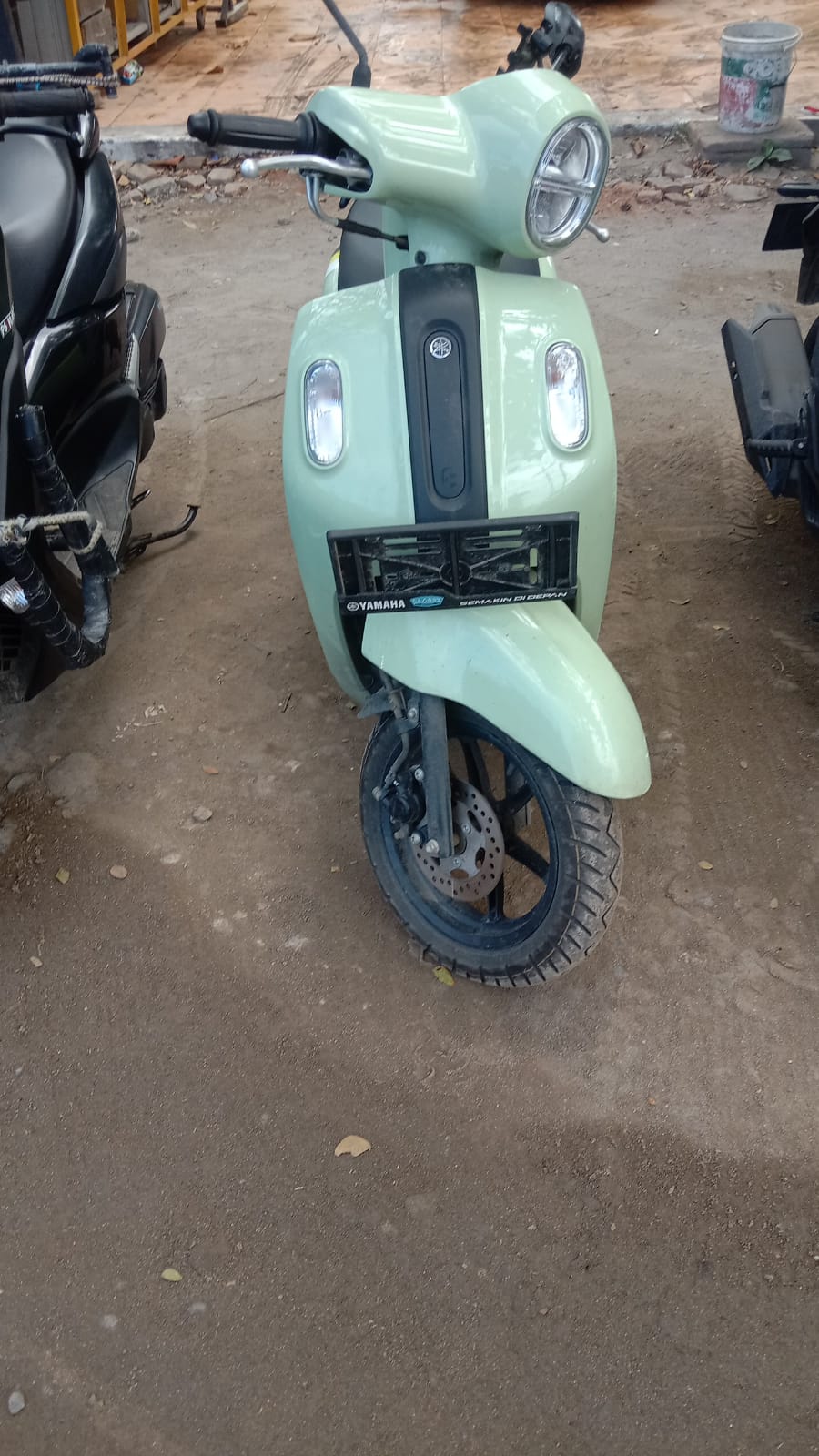 Black Yamaha NMAX scooter side view